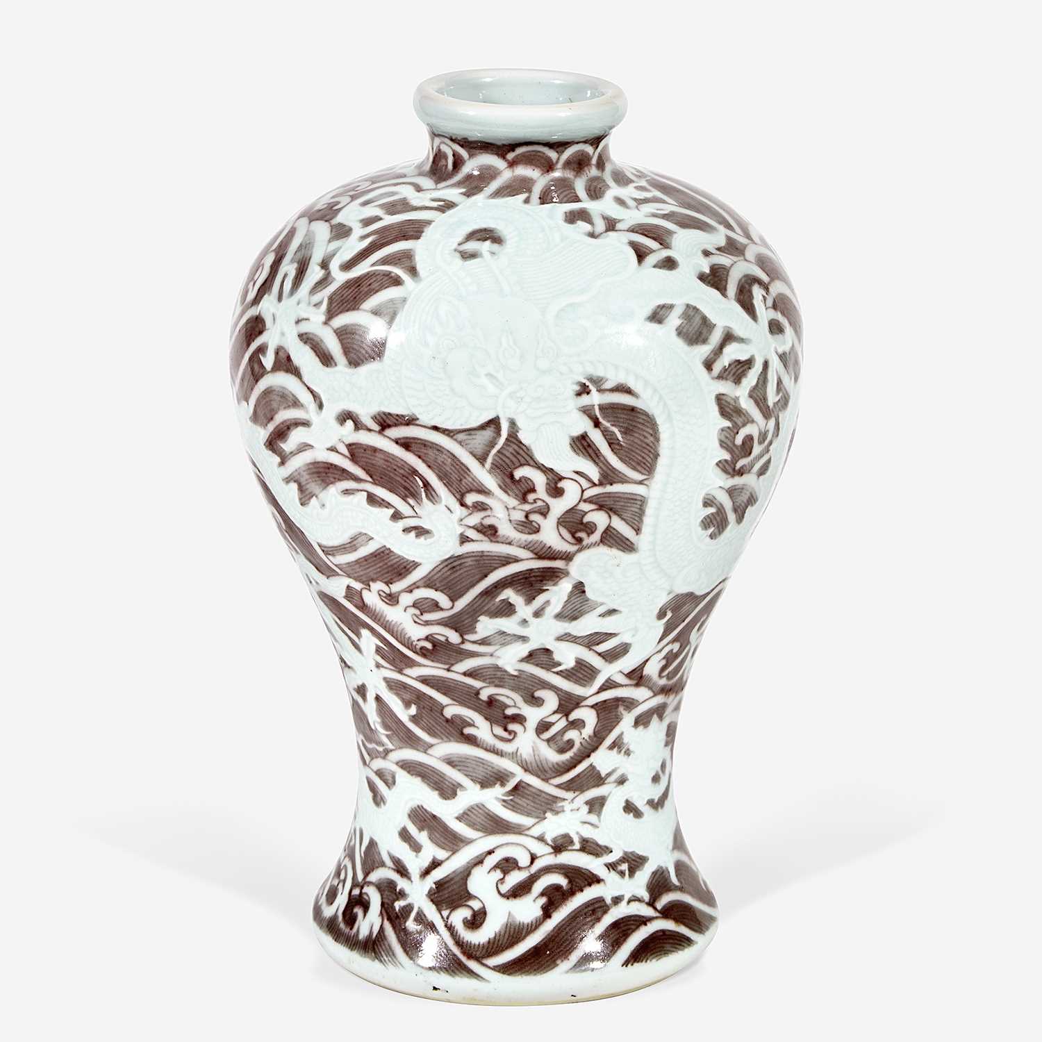 A Chinese carved and underglaze red Dragons and Waves vase, Meiping 